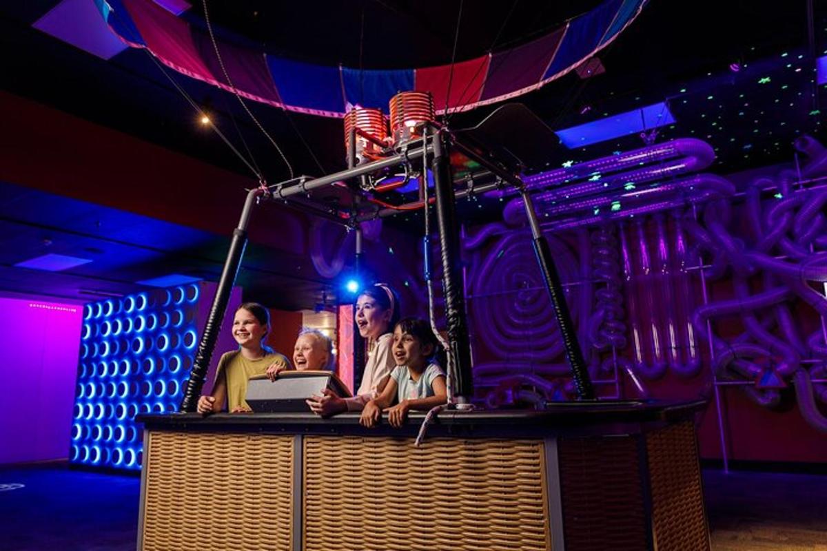 a group of people on a stage with a laptop