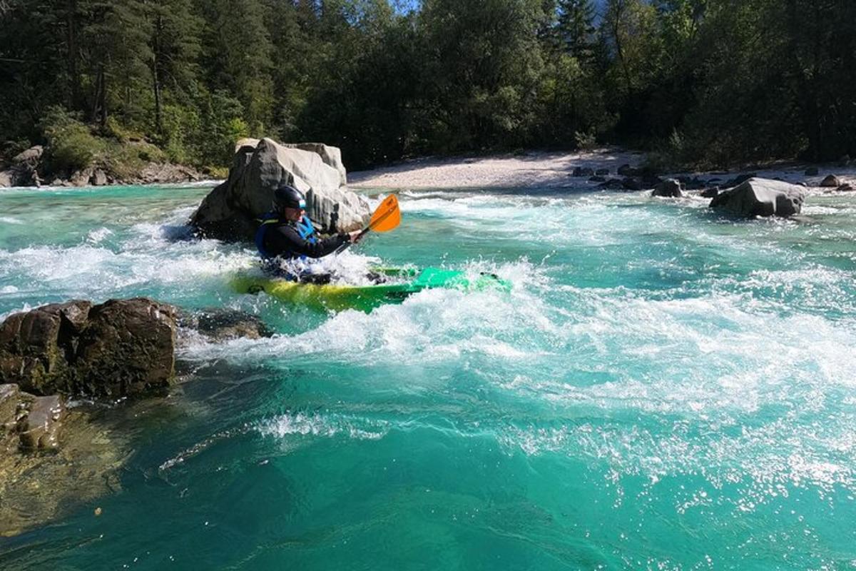 a man is paddling a kayak in a river