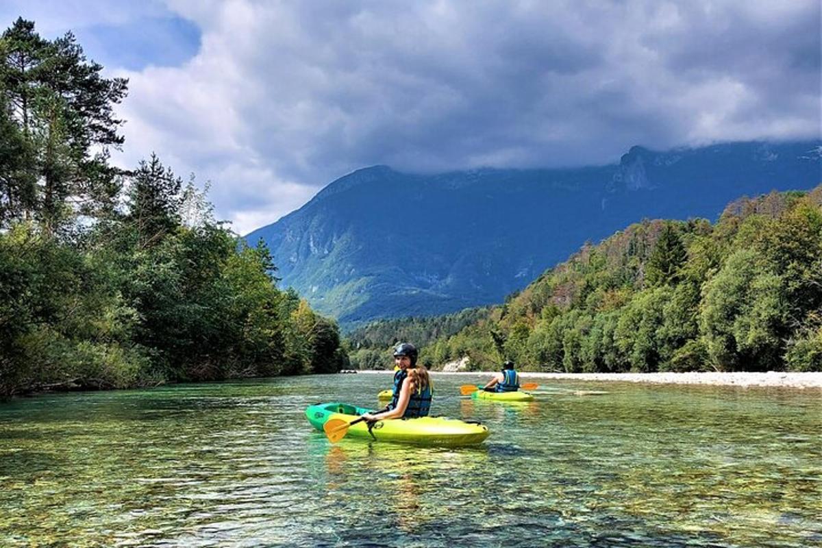 two people are kayaking down a river on a river