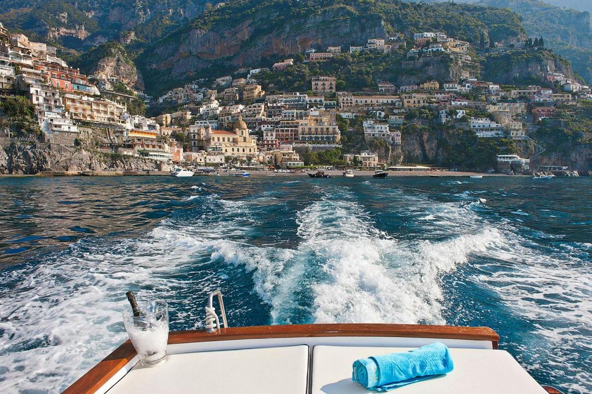 a boat in the water with a view of a city