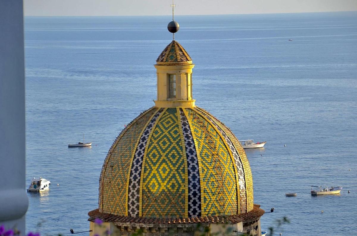a building with a tower on top of the water