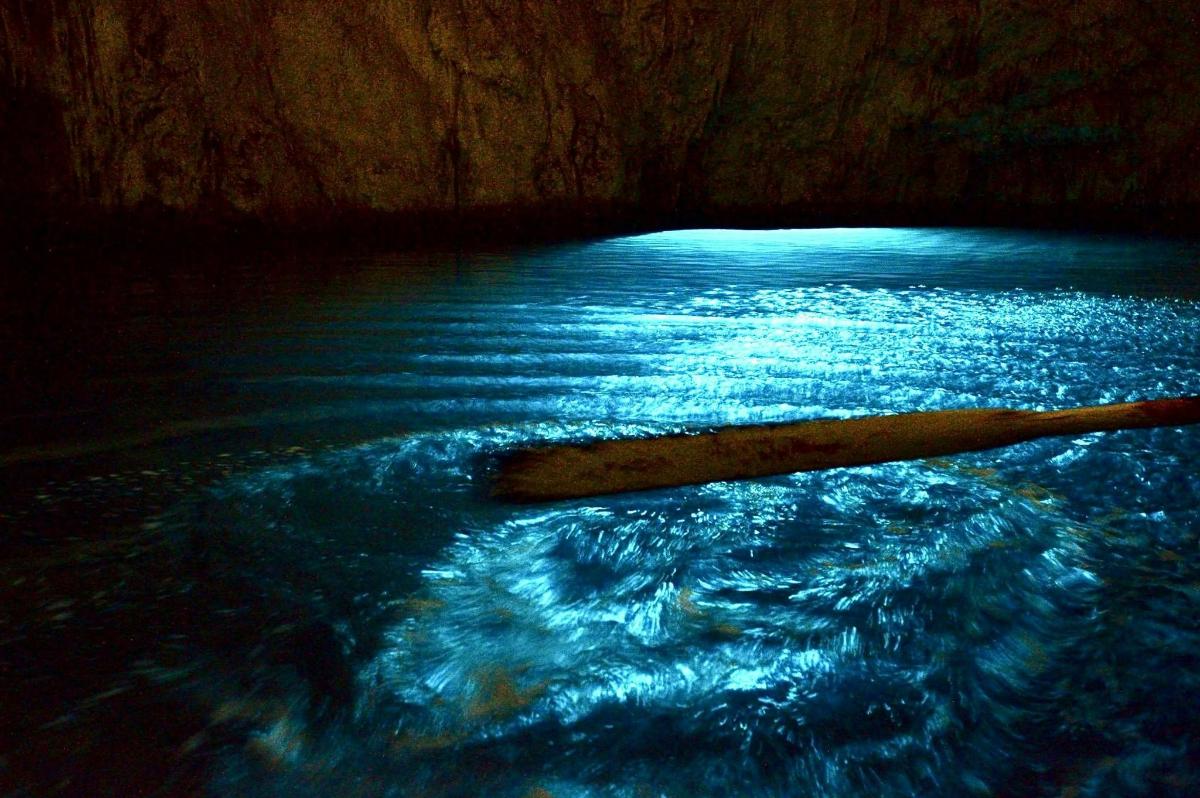 a boat in the water in a cave