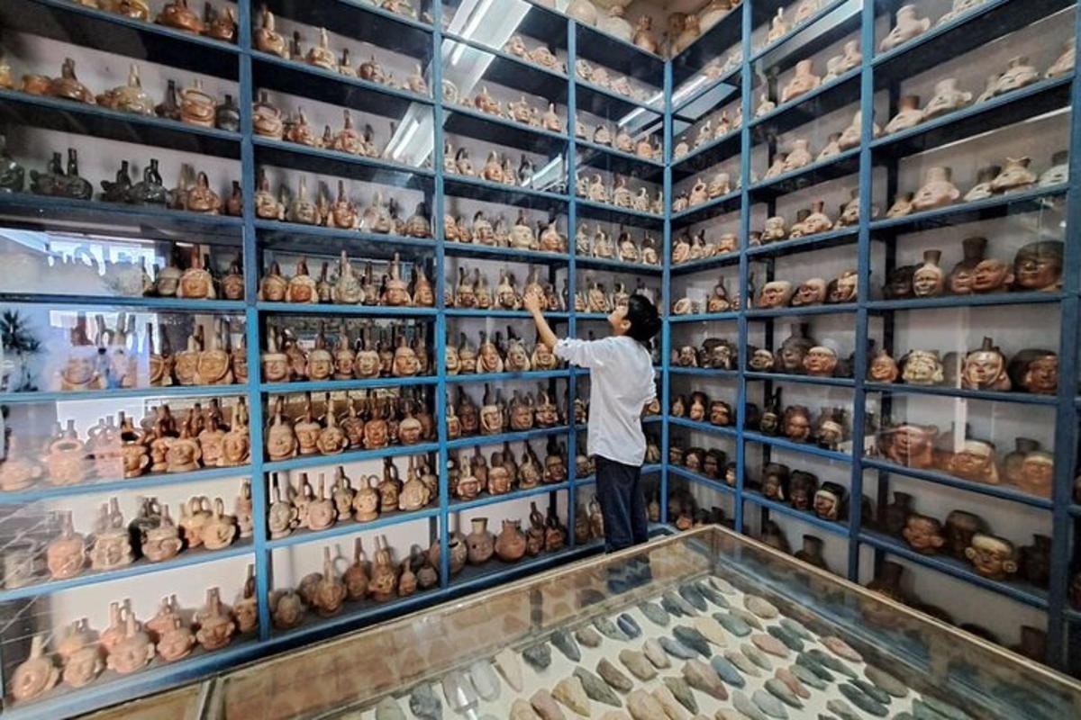 a man looking at a display of vases in a shop