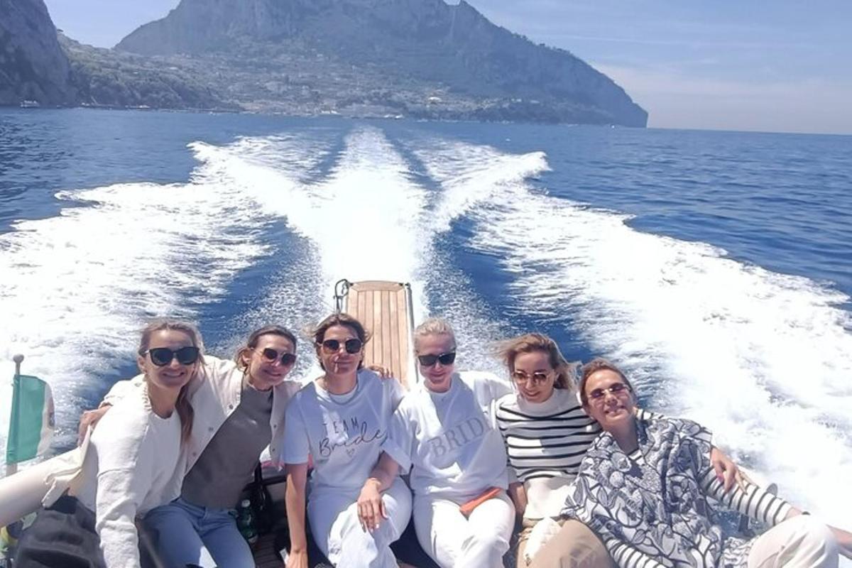a group of people on a boat in the water