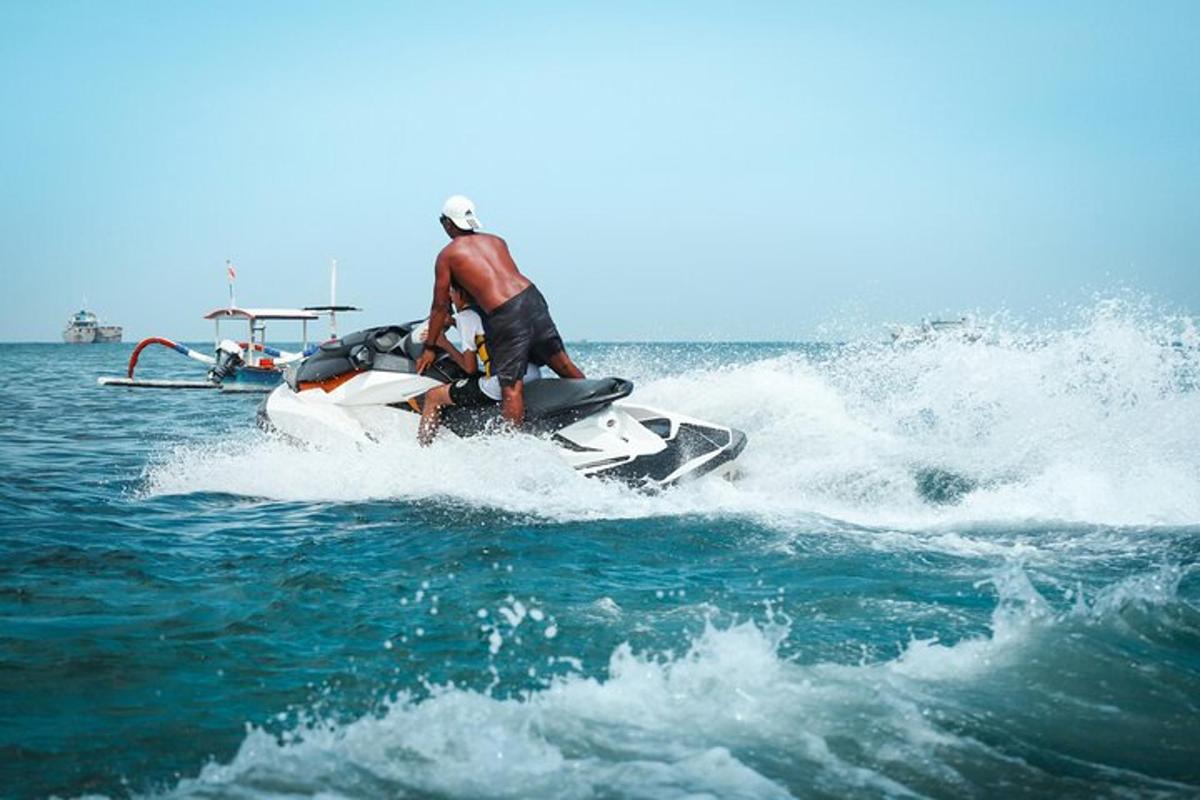 a man riding a jet ski in the water