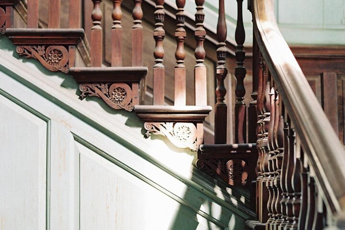 a balcony of a building with a wooden railing