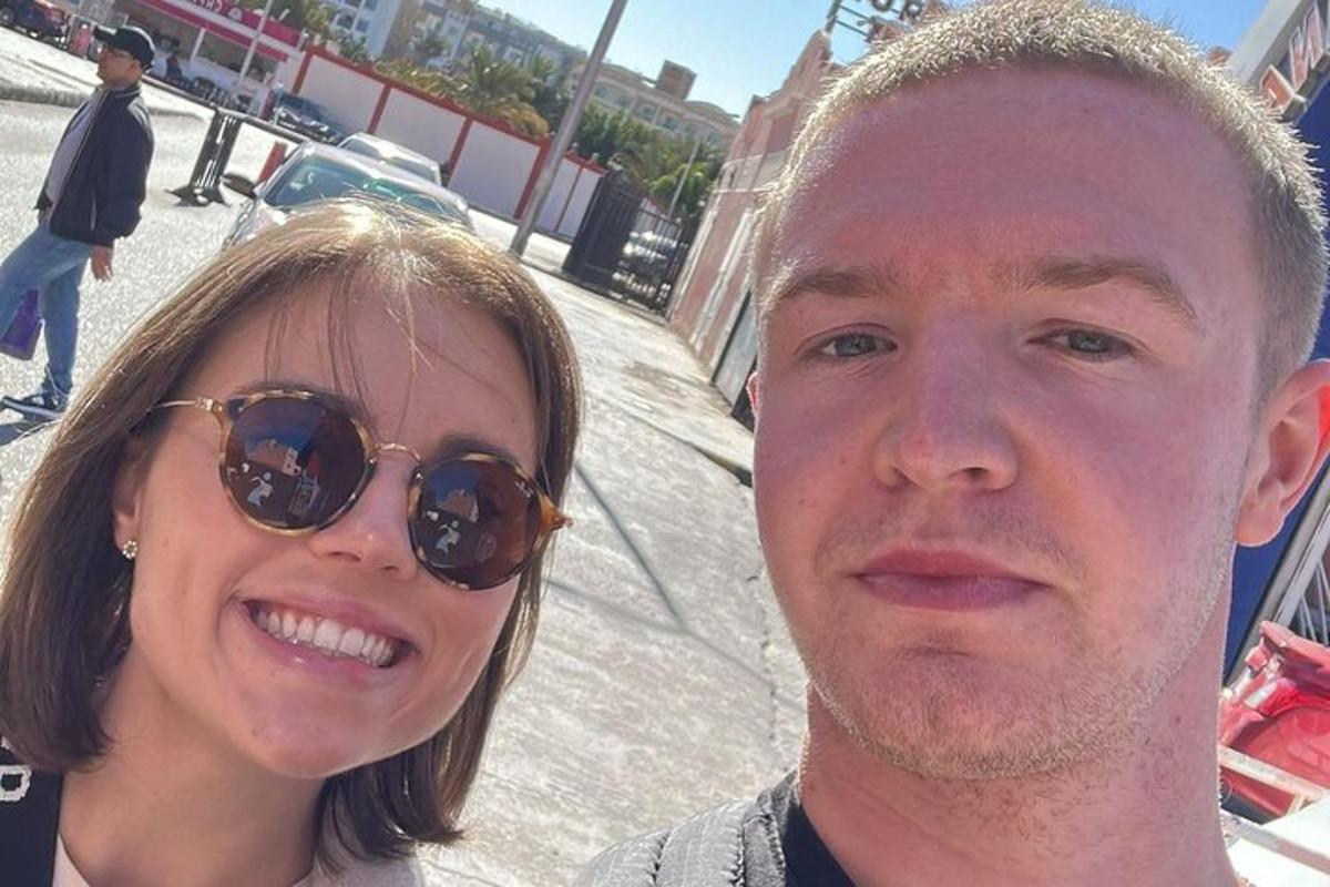 a man and a woman posing for a picture