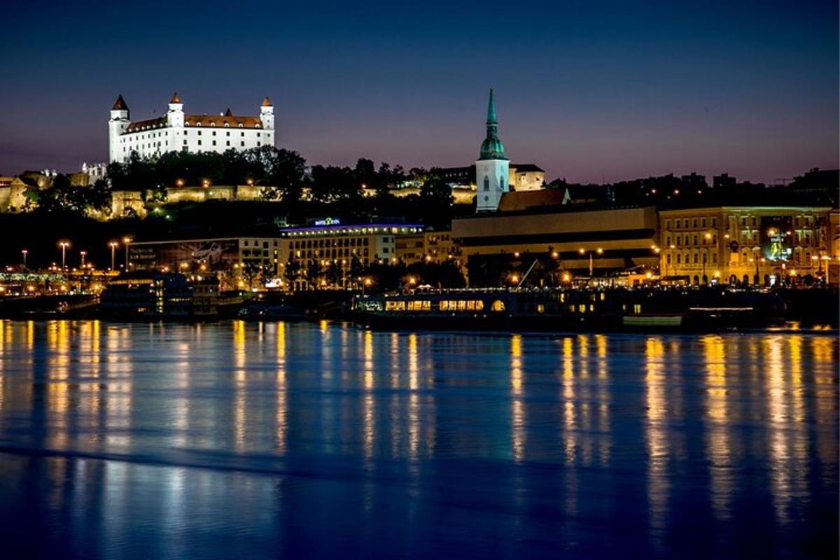 a view of a city at night with the water