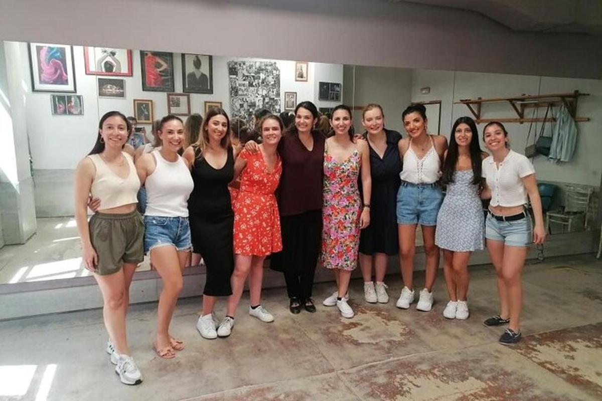 a group of women posing for a picture in a room