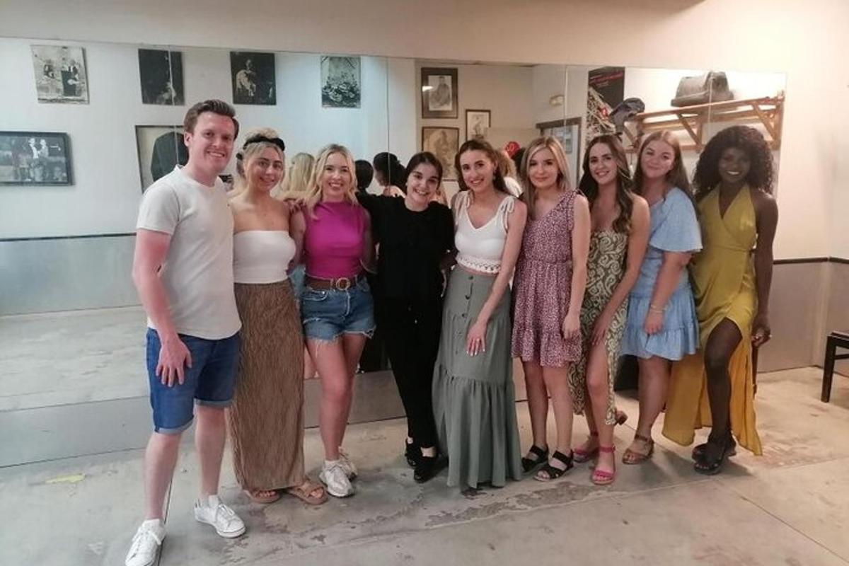 a group of people posing for a picture in a room