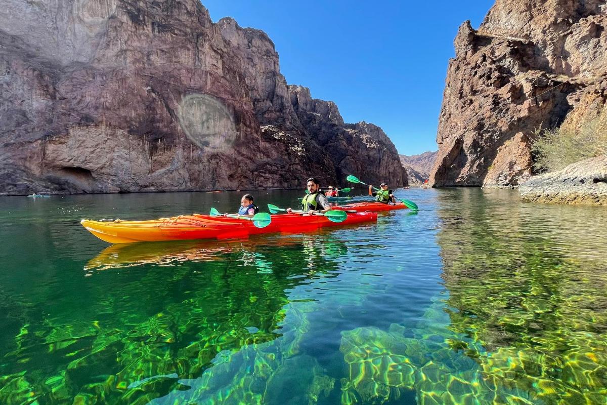 a group of people in kayaks in the water