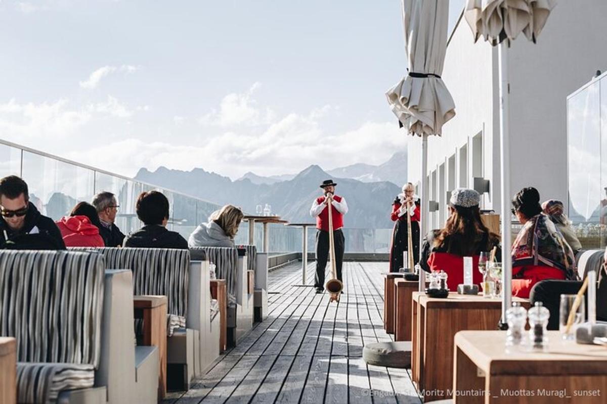 a group of people sitting on the deck of a cruise ship