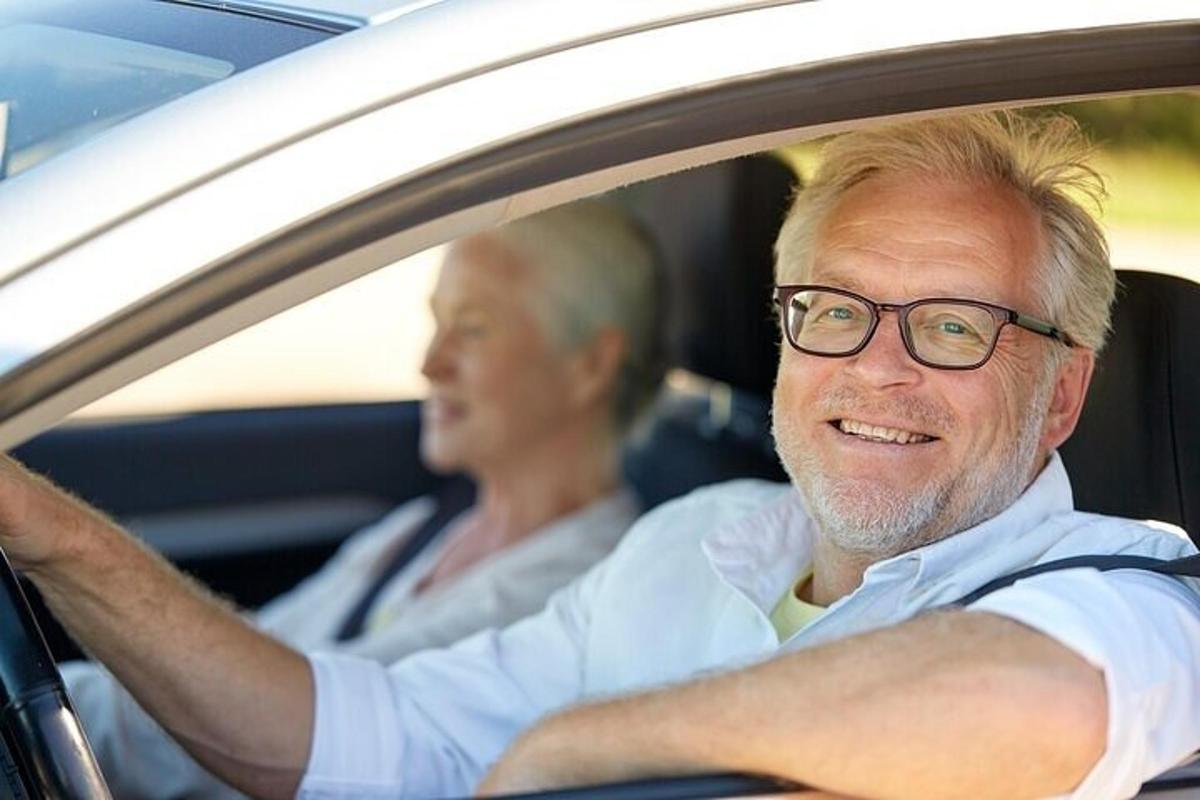 a man and a woman sitting in a car
