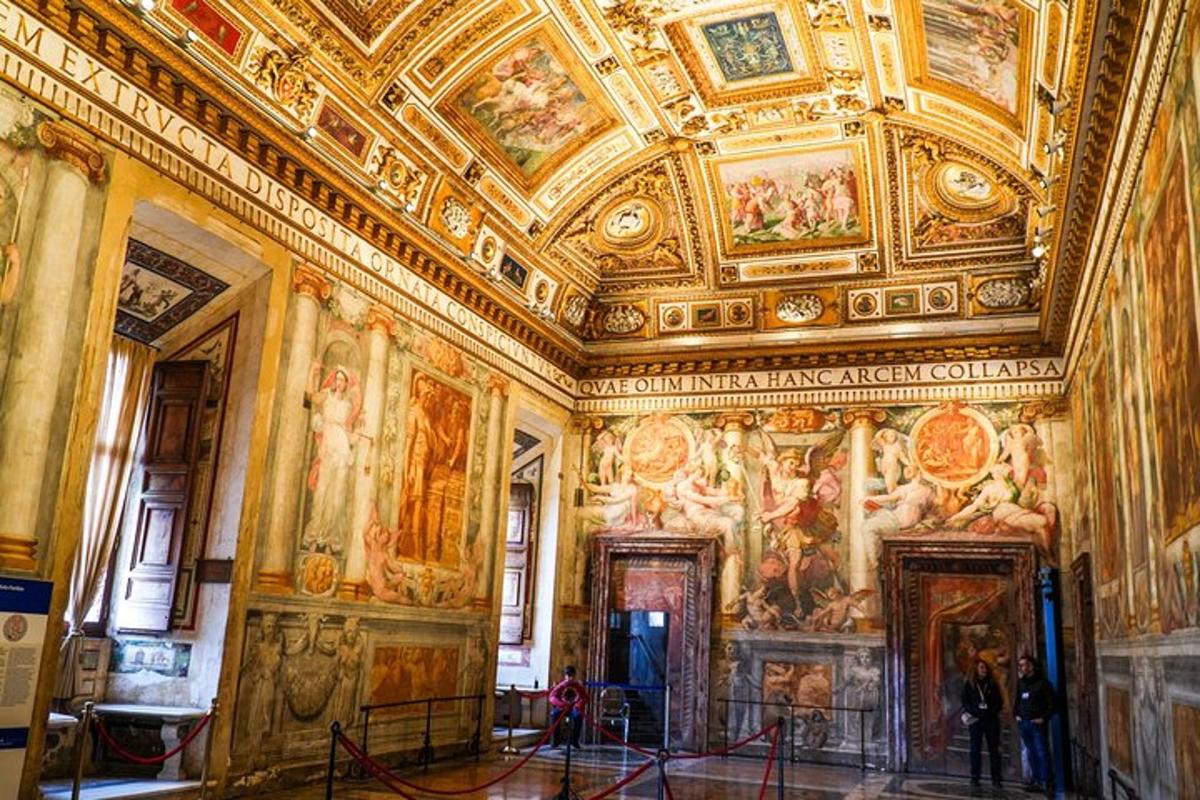 a room with paintings on the ceilings of a building