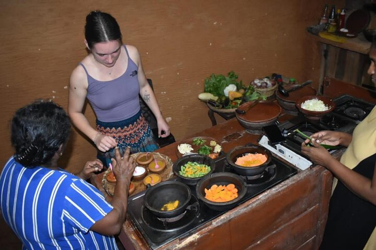 a group of people standing around a table with food