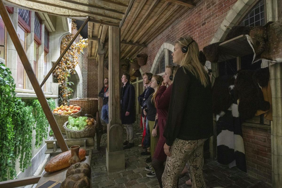a group of people standing inside of a building