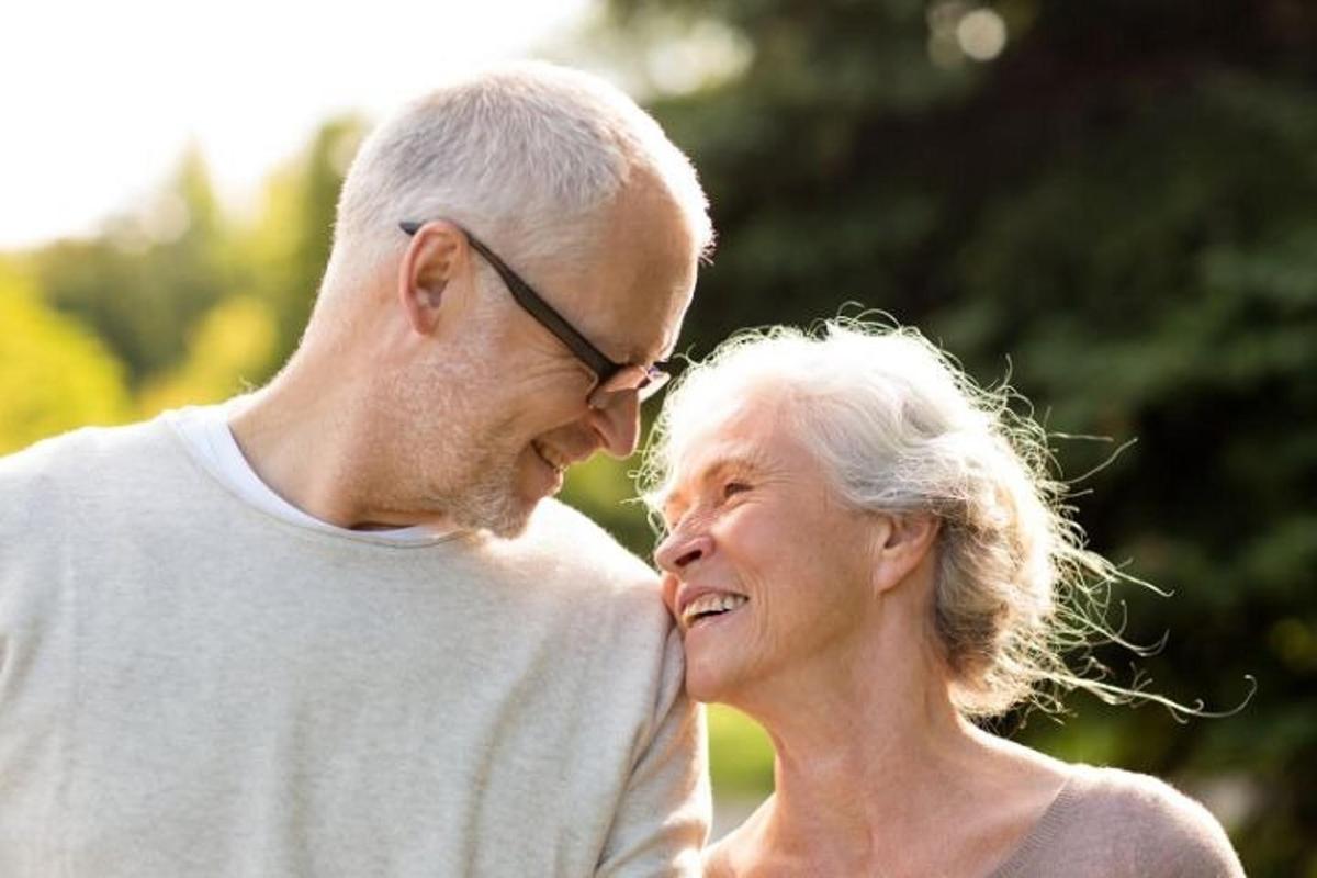a man and an older woman are smiling