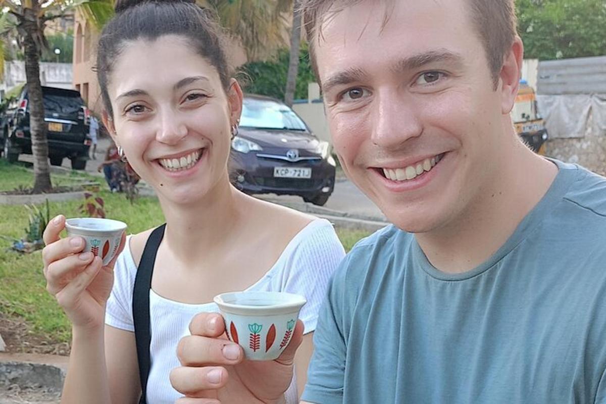 a man and a woman holding cups in their hands