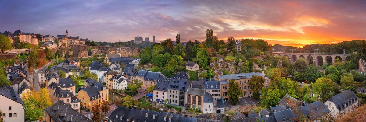 an aerial view of a city at sunset