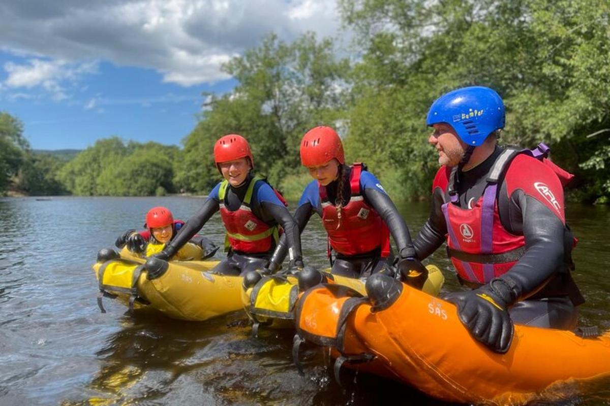 a group of people in a raft in the water