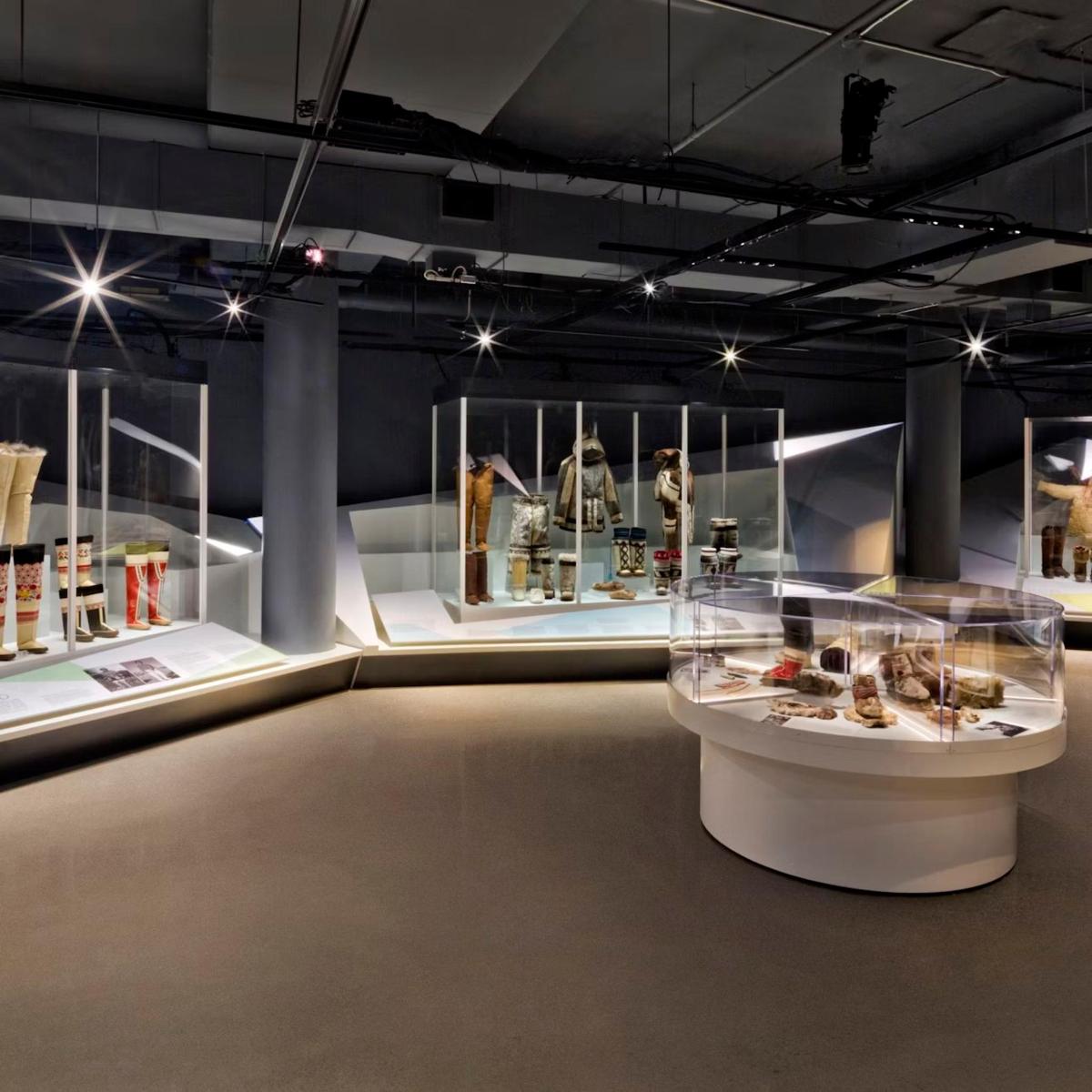 a display case in a museum with many items on display
