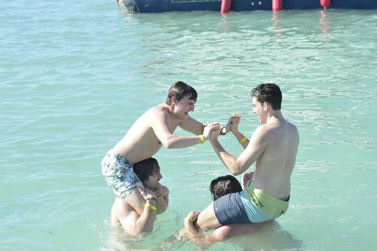 a group of three men in the water