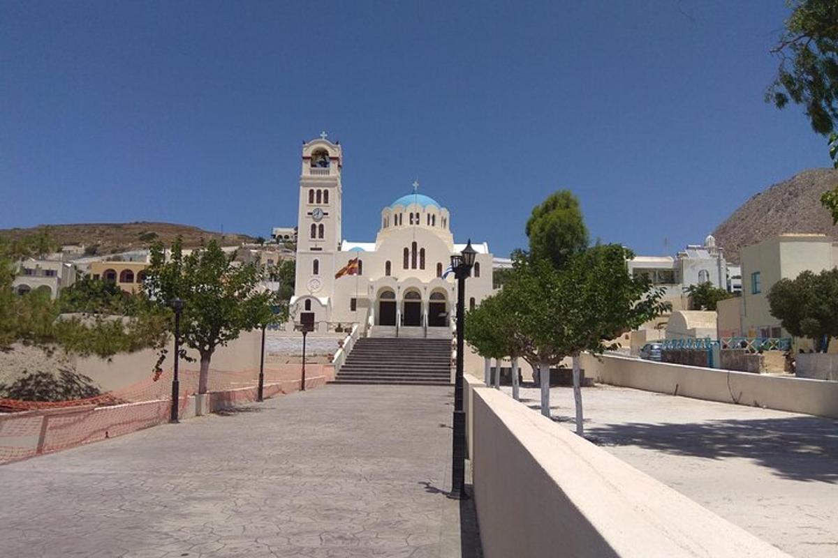 a large white building with a clock tower