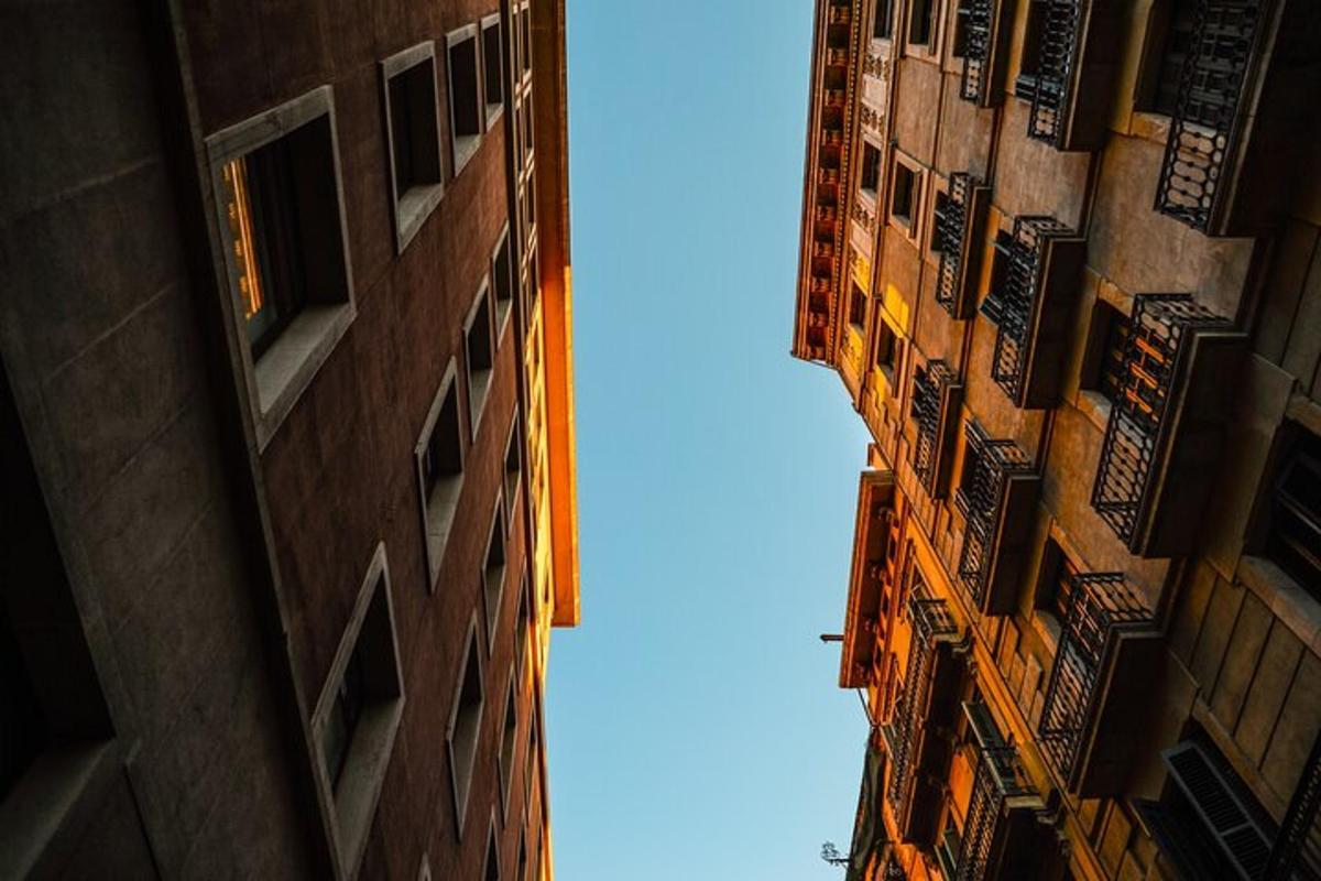 a view of the sky between two tall buildings