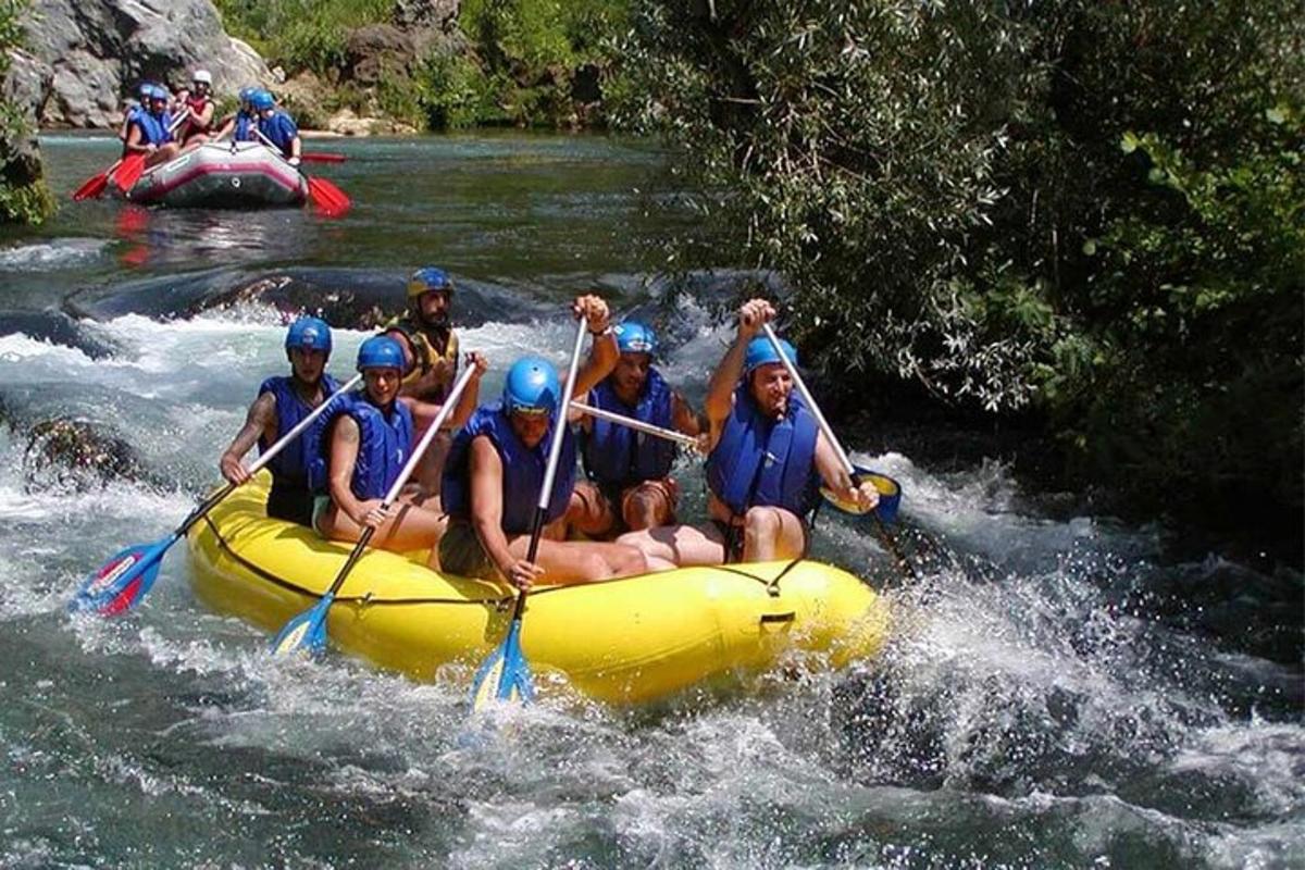 a group of people in a raft on a river