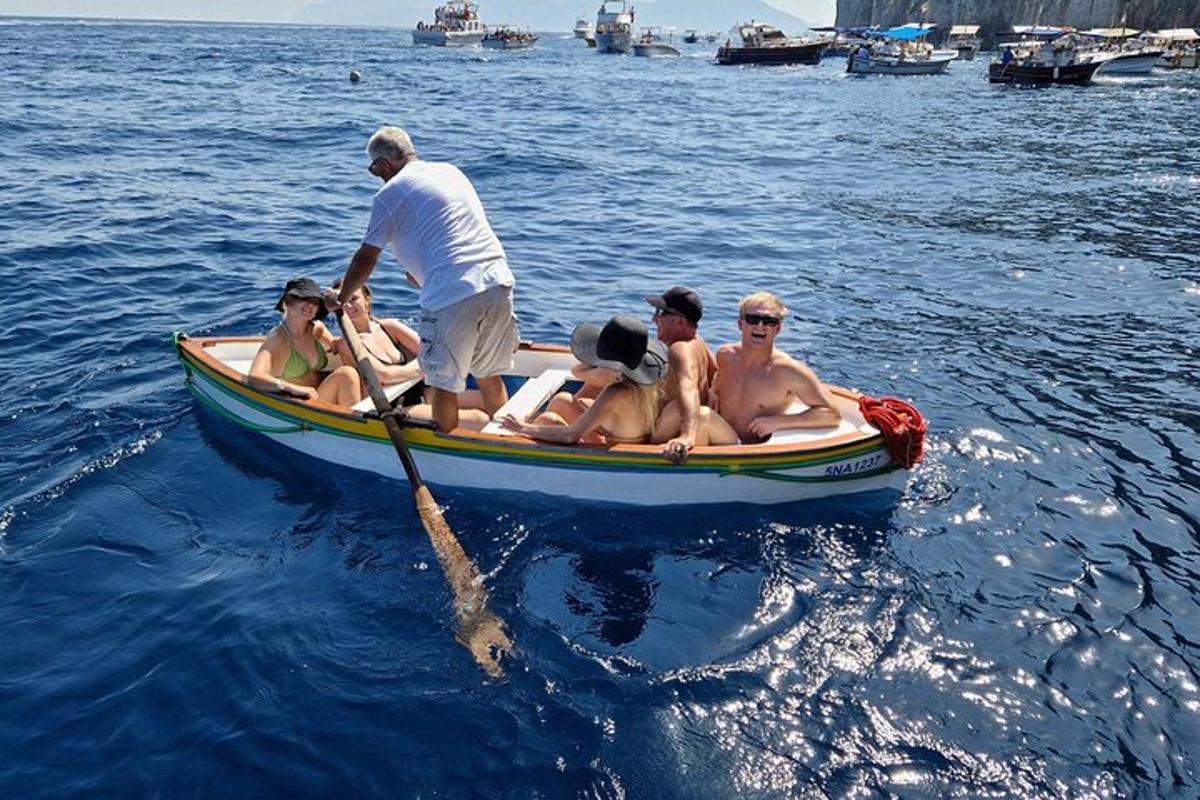 a group of people in a boat on the water