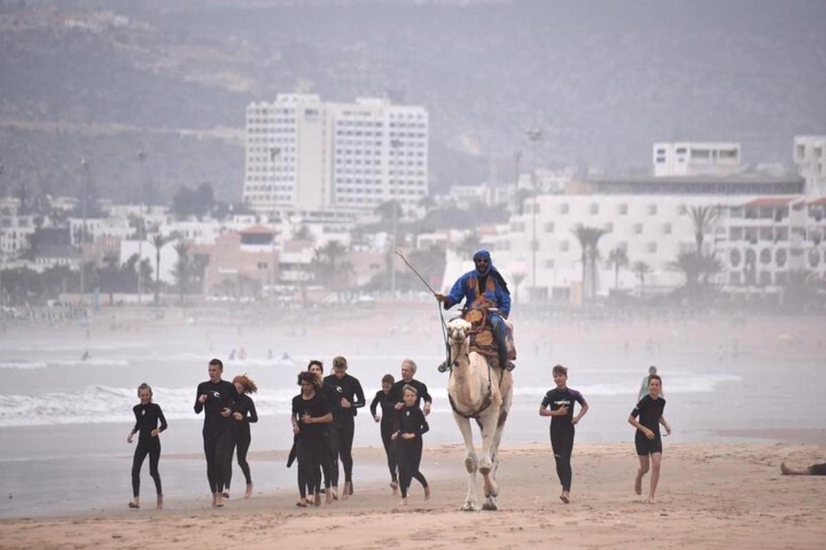 a man is riding a horse on the beach