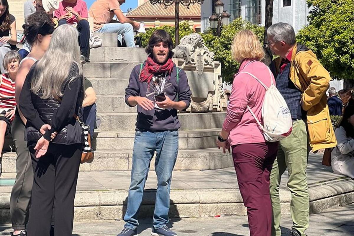 a group of people standing in front of a fountain