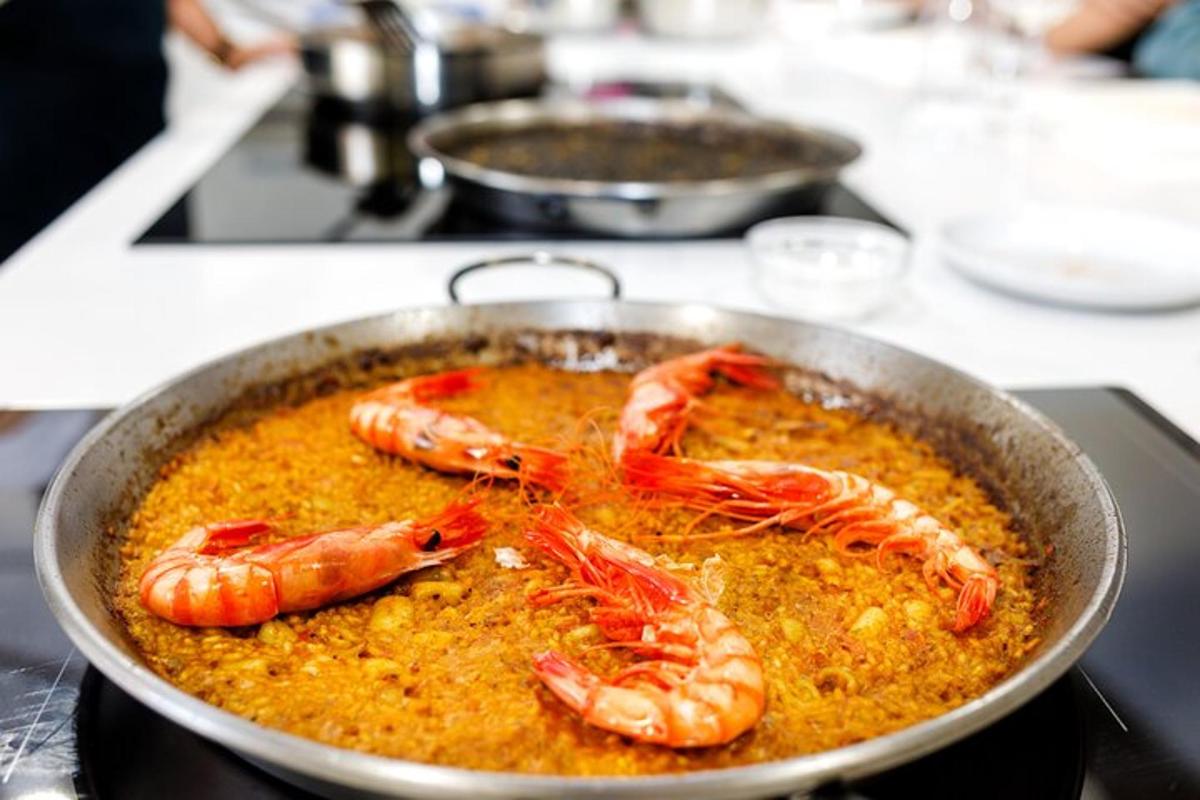 a bowl of food with shrimp in a sauce