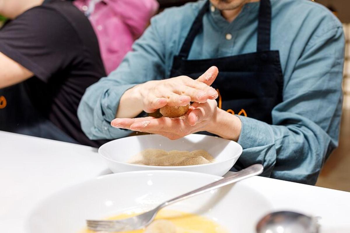 a person sitting at a table with a bowl of food