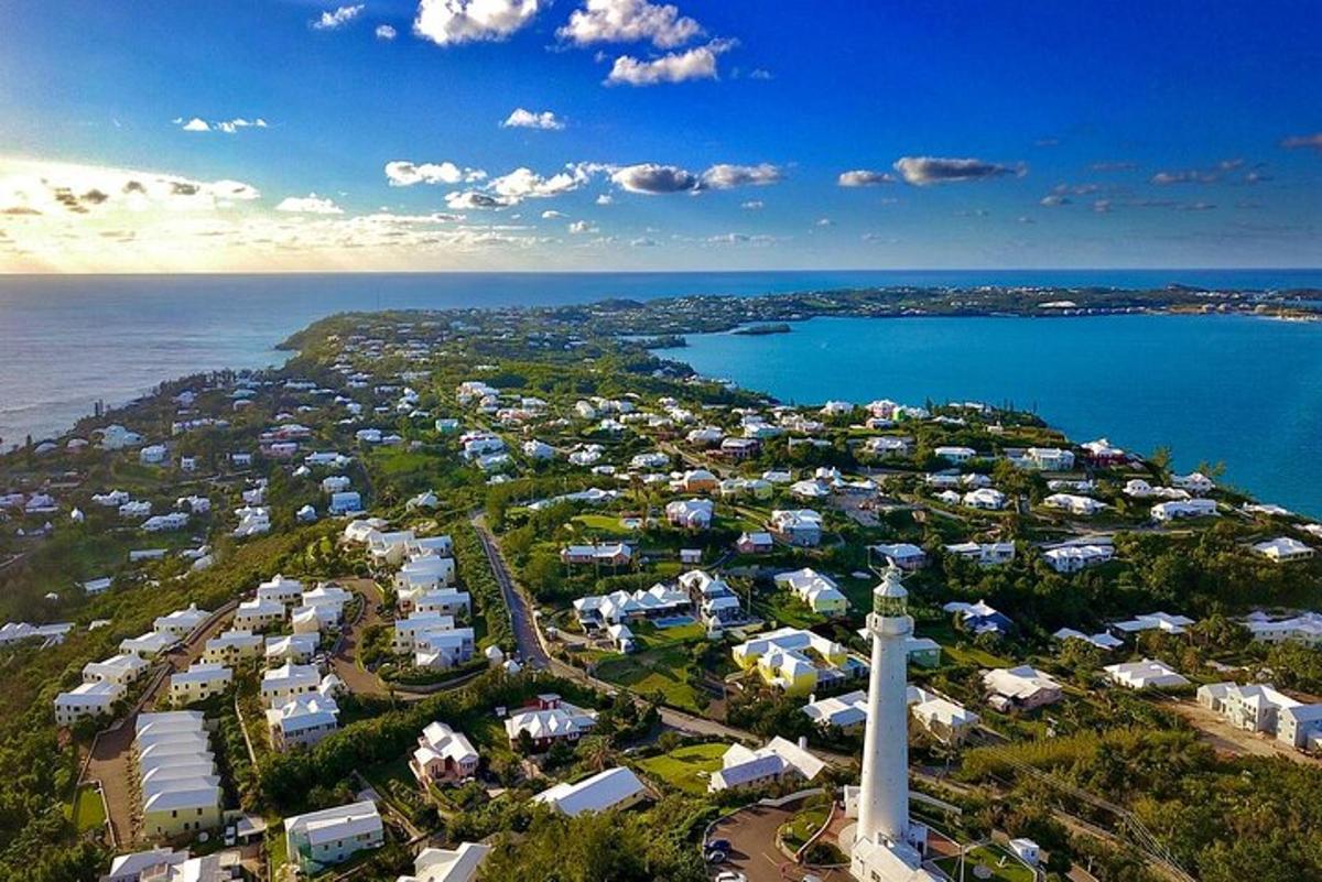 an aerial view of a resort with a lighthouse