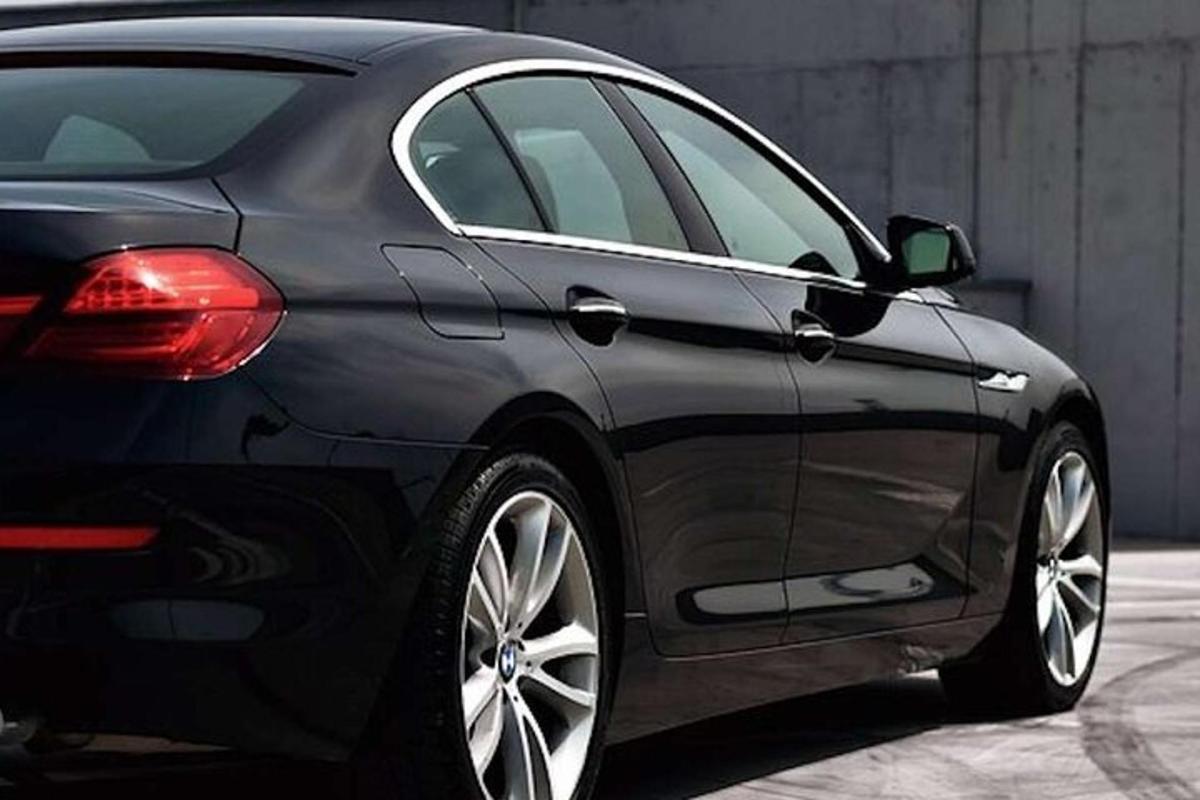 a black car is parked in a garage