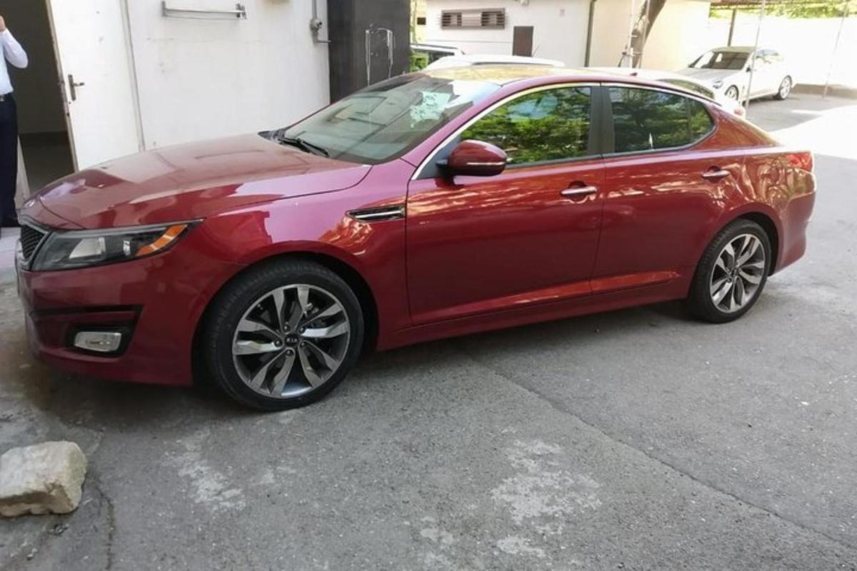 a red car parked in a parking lot