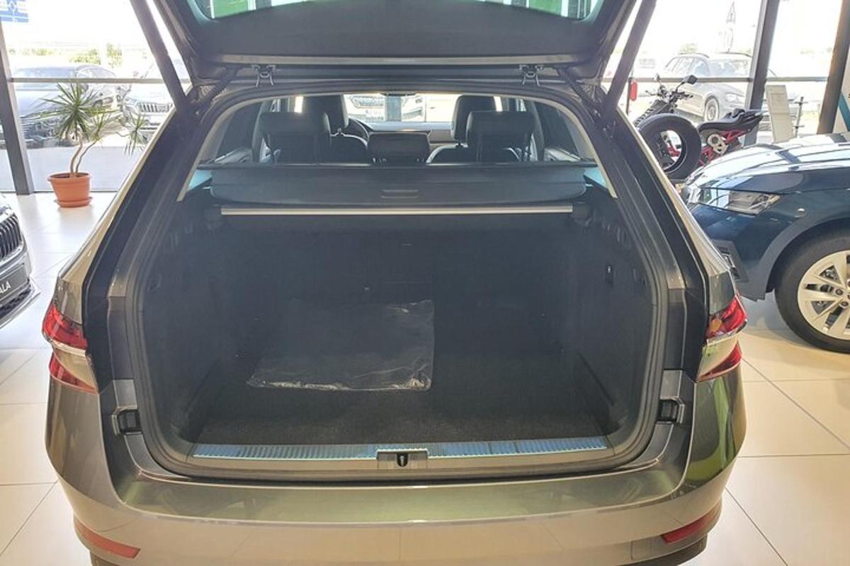 a car with its trunk open in a parking lot
