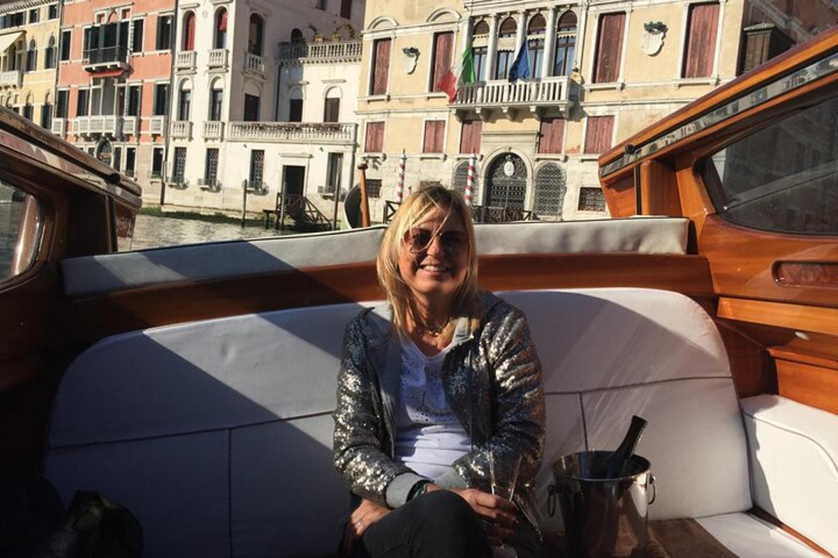 a woman sitting on the back of a boat