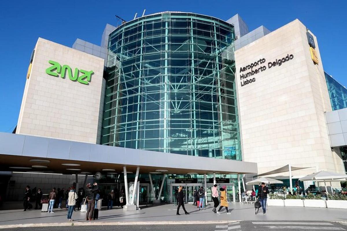 a large building with people walking in front of it