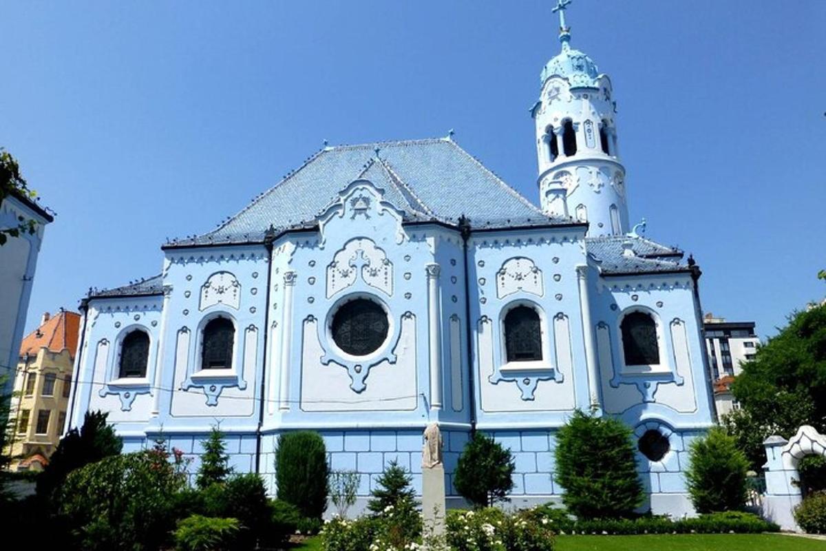 a blue and white church with a tower