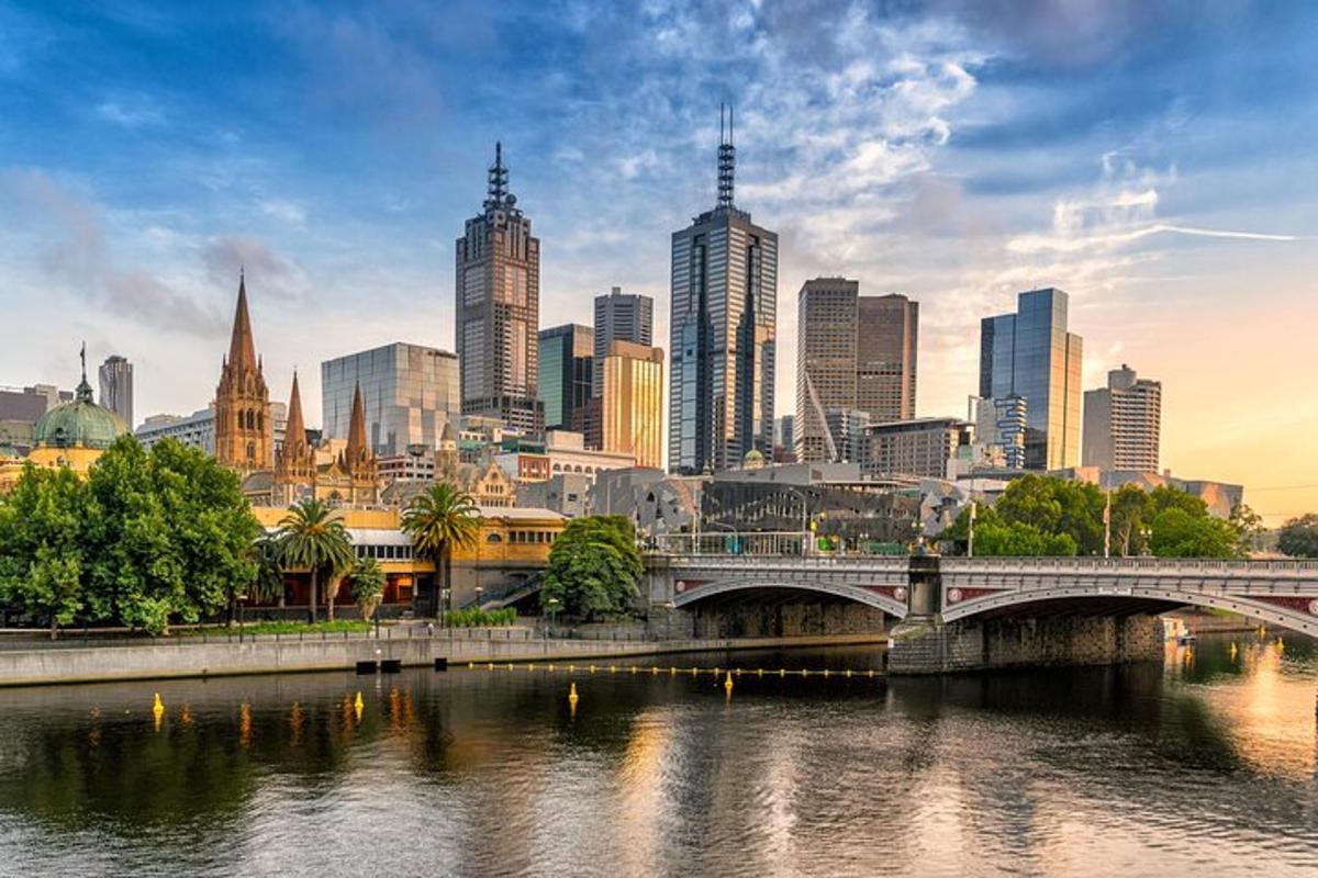 a city skyline with a bridge and a river