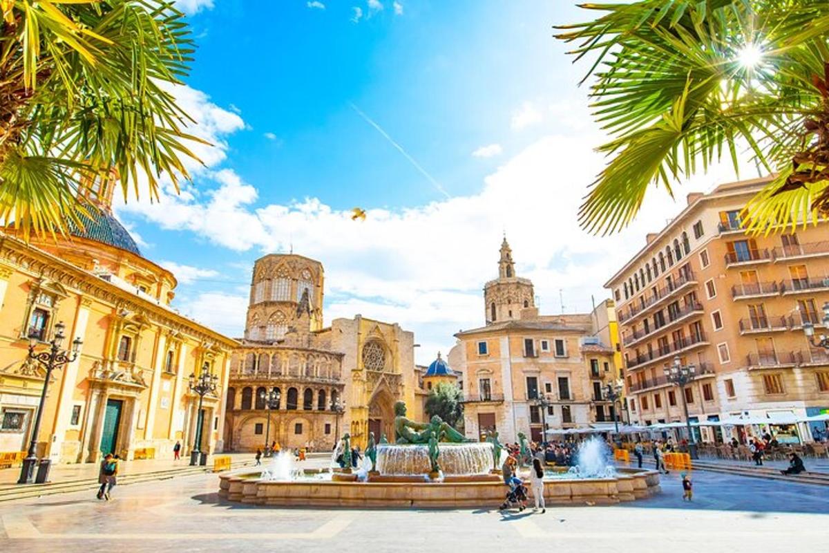 una piazza cittadina con una fontana di fronte agli edifici