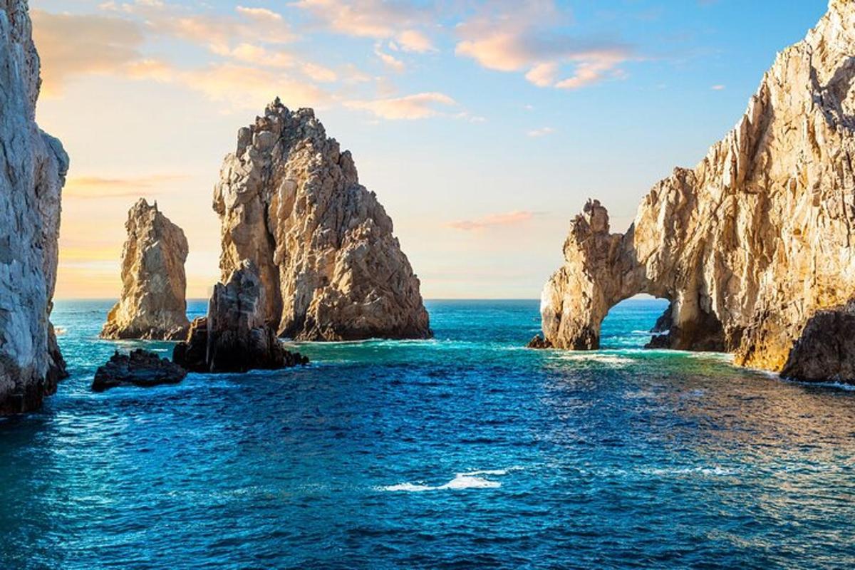 a view of the ocean with rocks in the water