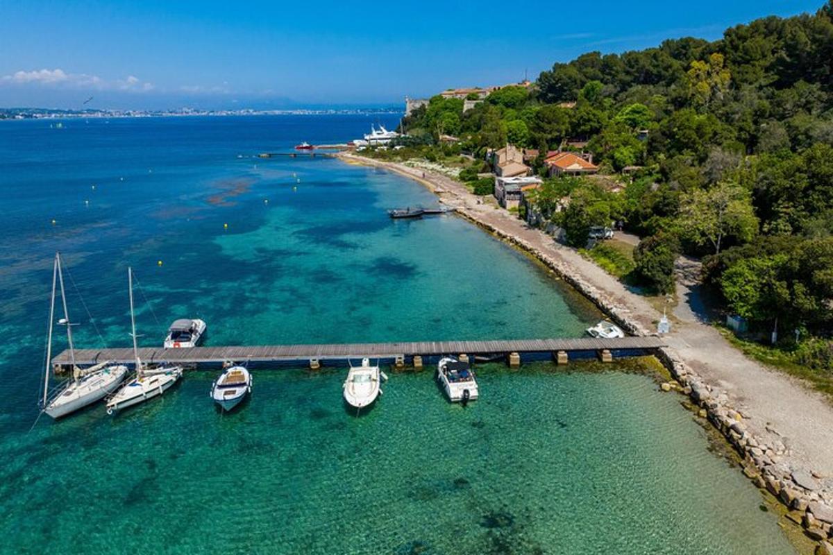 a group of boats docked at a dock in the water
