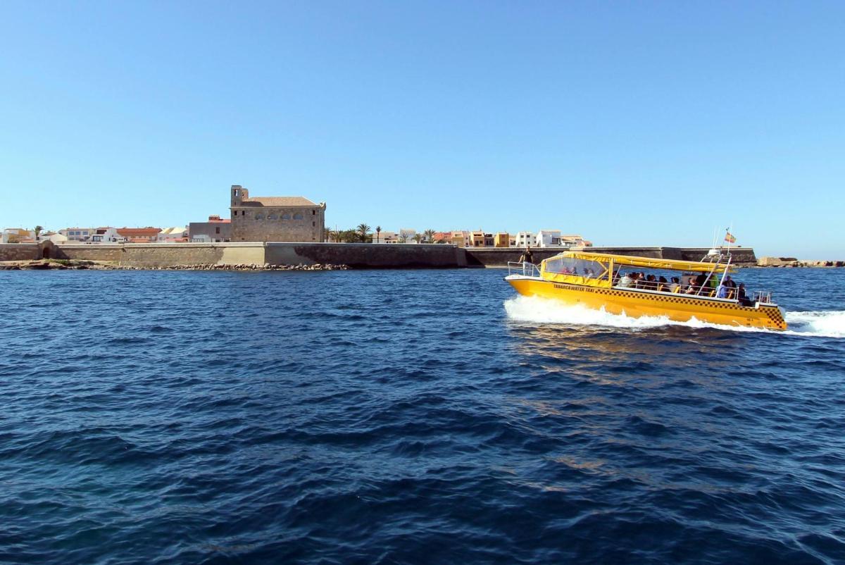 a yellow boat in a body of water
