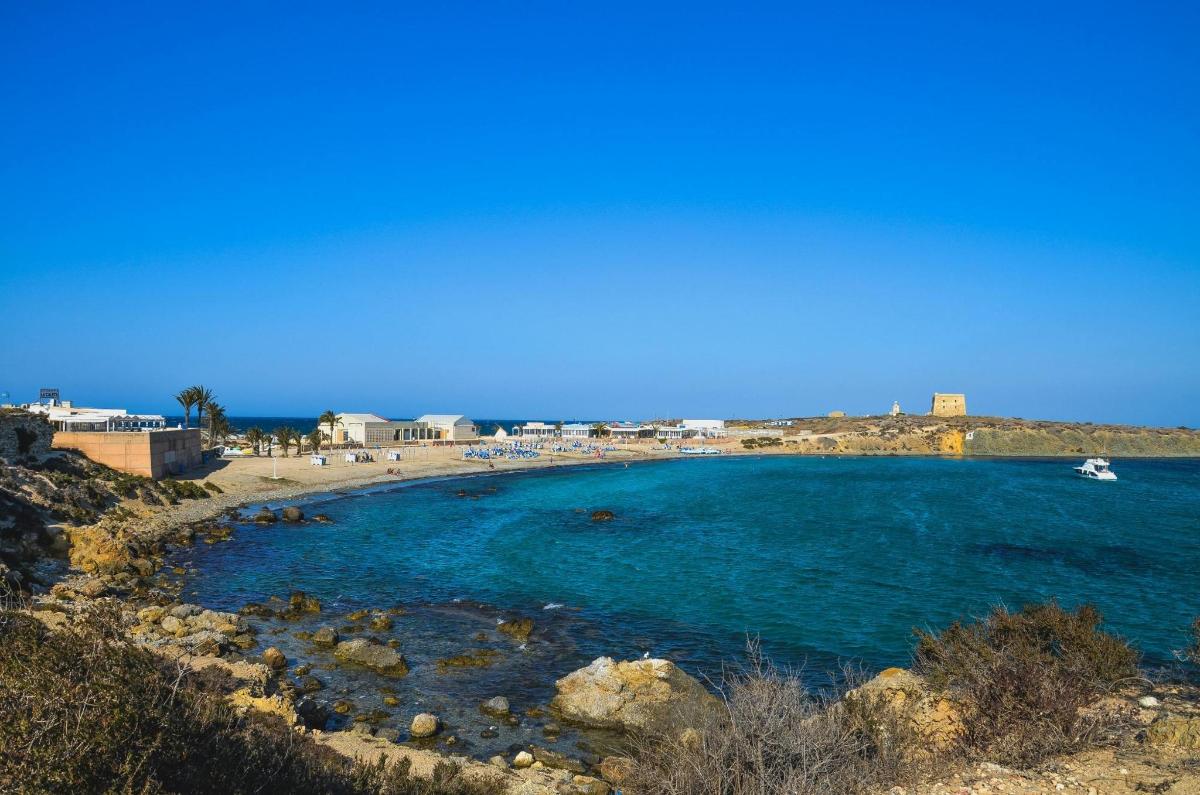a view of a beach with a boat in the water