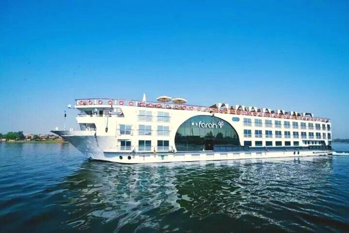 a cruise ship with people on it on the water