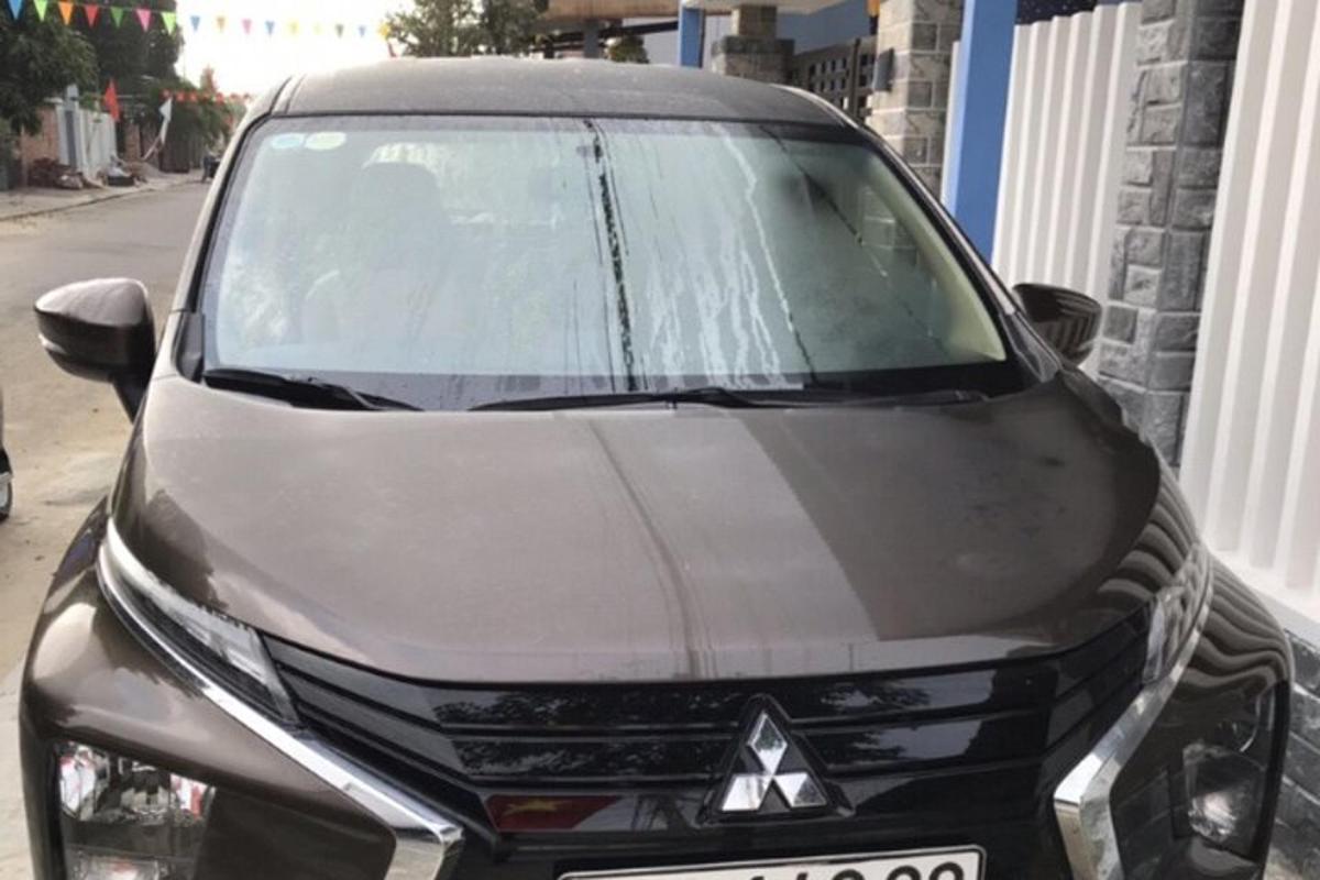 a black car parked on the side of a street