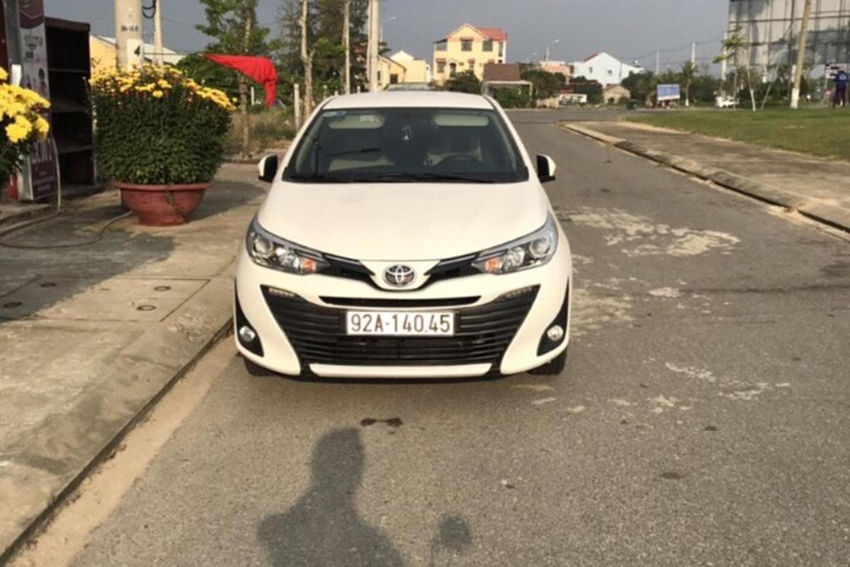 a white car parked on the side of a road